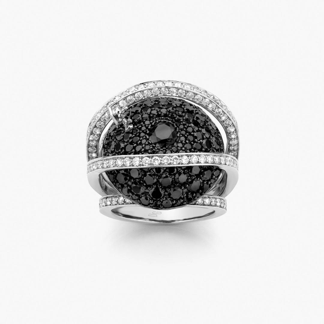 The Saturn ring is a unique piece in black diamond and white gold made by Atelier Wittmann